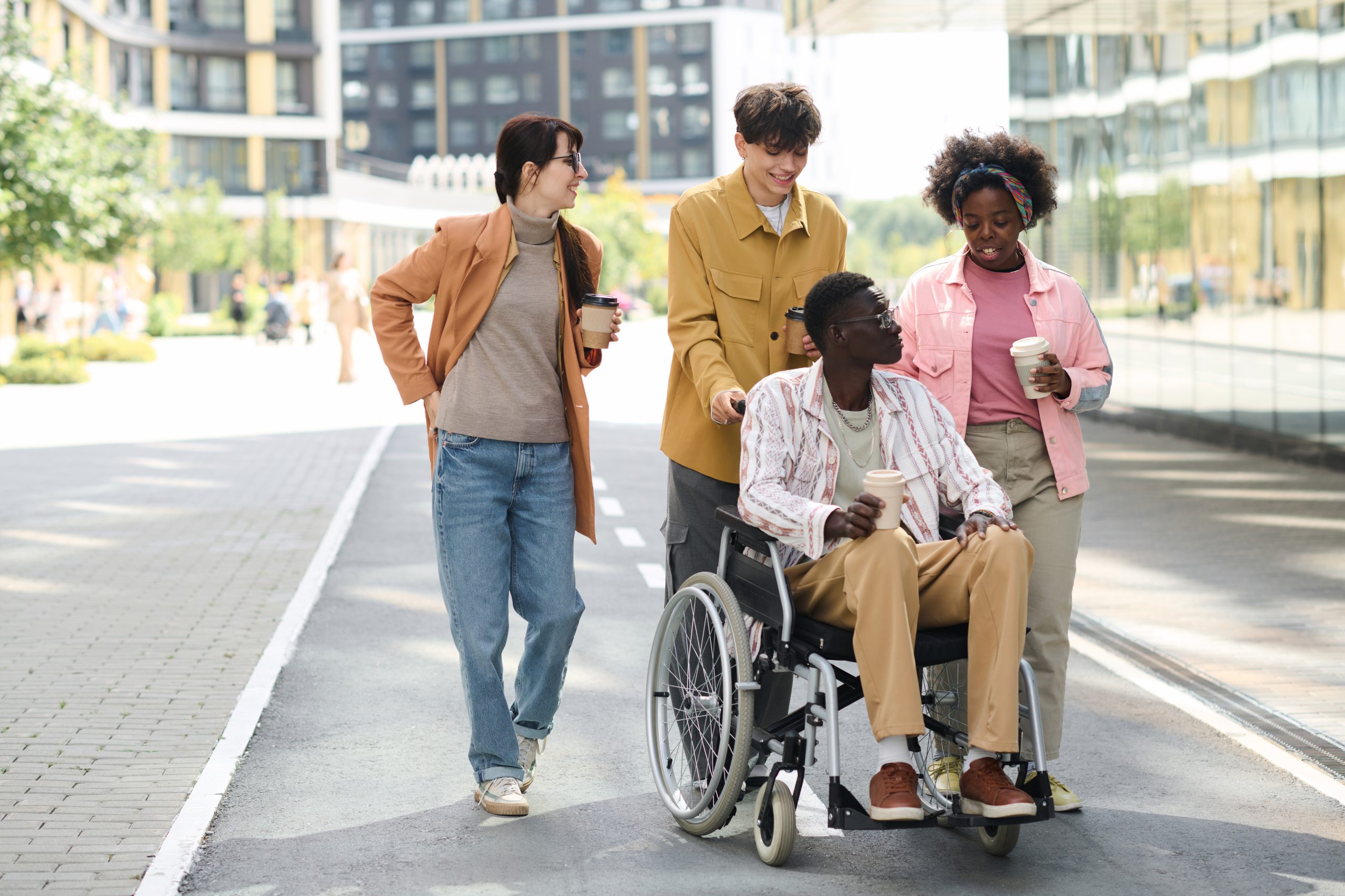 People Walking With Friend With Disability